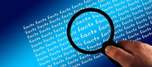 magnifying glass hoovering over the word facts